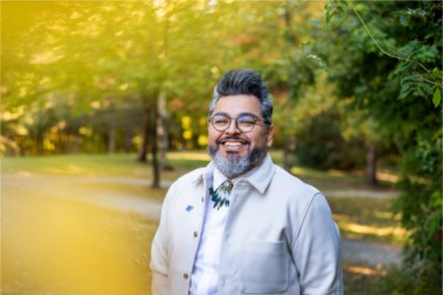 Tiburcio Lince, director of Grand Valley's Office of Multicultural Affairs, poses for a photo on Grand Valley's campus.