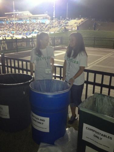 Students helped compost and recycle materials at the home opener September 7.