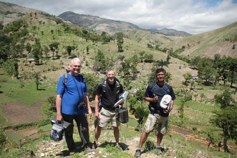Pictured are, from left, Rick Rediske, Peter Wampler and Azizur Molla in rural Haiti. The three are conducting a research project on water quality.