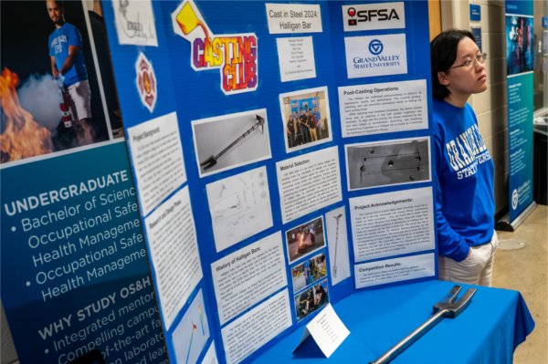 Madelyn Burrell stands next to the &ldquo;The Casting Club&rdquo; display as part of the Senior Project Showcase