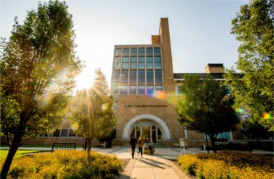 Photo of L. William Seidman Center exterior as students walk by.