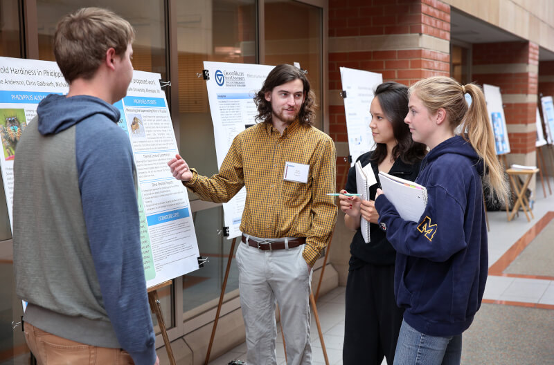 poster presentation, four people