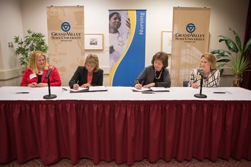Photos by Jess Weal  From left are Teresa Sturrus, Christina Donley, Gayle R. Davis and Cynthia McCurren signing a concurrent enrollment agreement between KCON and MCC.