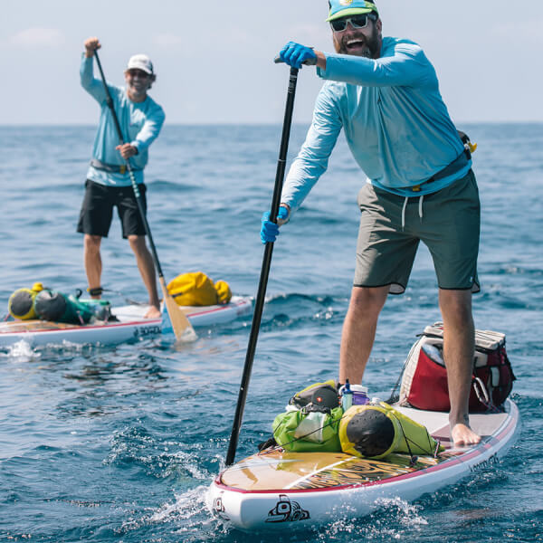 two men on paddleboards