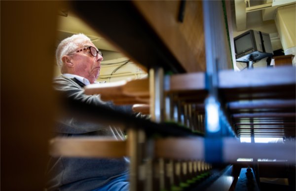  A carillonneur makes a funny face as he practices the carillon. 