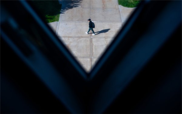  A triangular-shaped window created a v-shape where a student walks past. 