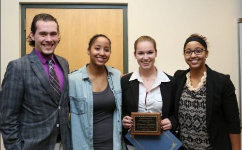 Grand Valley Hult Prize director Michael Kurley with members of "Platform for Progress" team.