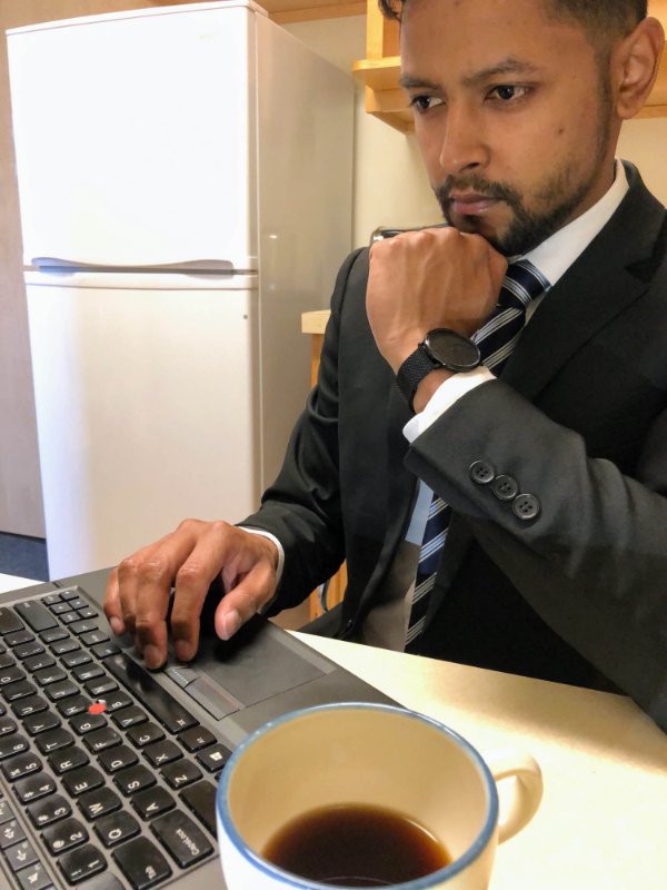 Photo of grad student Marlon Pereira De Amorim at computer.