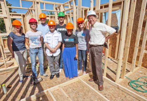Grand Valley students and community members participating in Habitat for Humanity builds as part of the Kaufman Interfaith Institute's 2015 Year of Interfaith Service.