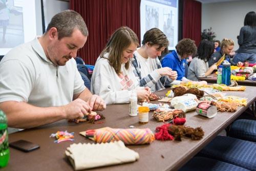  Participants make goods to be donated to area organizations at a 2014 Martin Luther King Jr. Day event. This year's commemoration week will run January 19-24.
