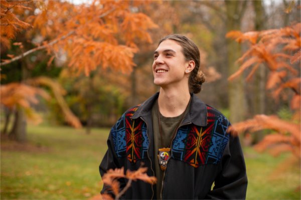 GVSU Senior, Simon Baker poses for a portrait outdoors on campus. 