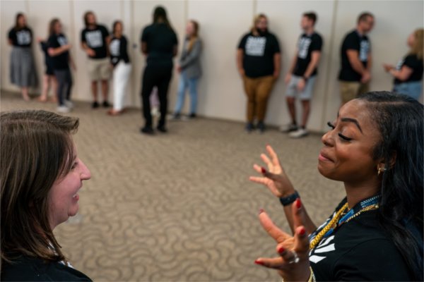 Morgan Dailey, right, and Lauren Wenstrup, talk during the West Michigan Teacher Collaborative Summer Institute at the Eberhard Center in Grand Rapids on July 22. Dailey is the coordinator and Wenstrup is the administrative assistant for the West Michigan Teacher Collaborative.