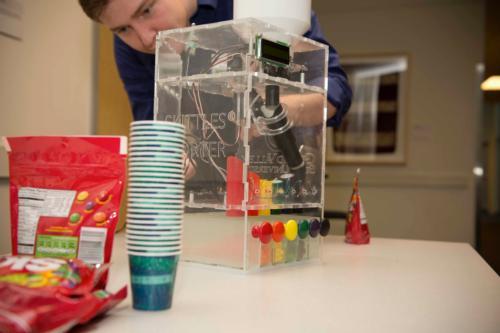 A Skittles sorting machine was one of many student projects displayed at the Padnos College of Engineering and Computing's Project Day.
