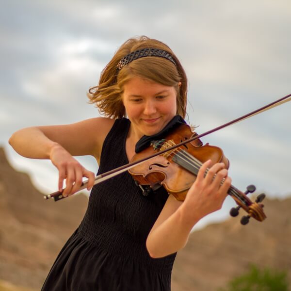 Sarah Dowell warms up before a performance at Badlands National Park during the New Music Ensemble's 2016 national parks tour.