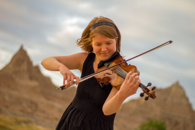 Sarah Dowell warms up before a performance at Badlands National Park during the New Music Ensemble's 2016 national parks tour.
