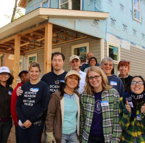 GVSU students and community members participate in a Habitat for Humanity of Kent County build to kick off the 2015 Year of Interfaith Service.