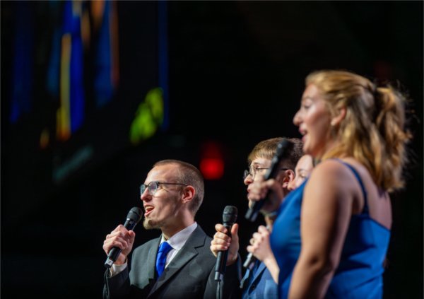  A singing group performs during a commencement ceremony. 