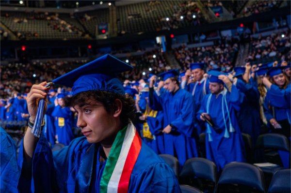  A graduate moves their tassel from right to left to signify their graduation.