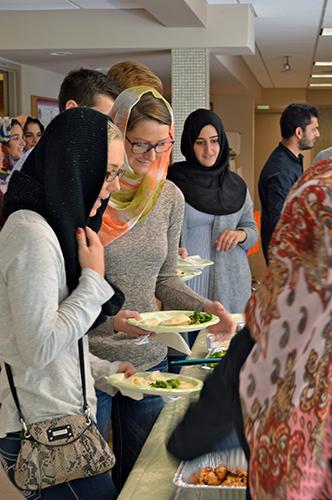 Students enjoy a lunch at the slamic Mosque and Religious Institute in Kentwood.