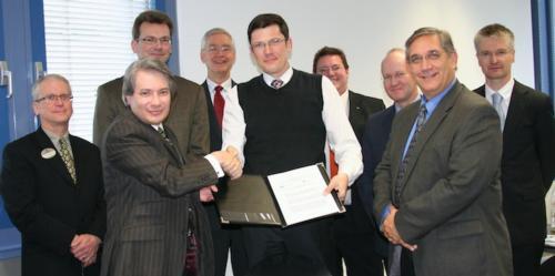 From left, Career Service's Tom Demmon, Joe Iannelli, and the School of Computing and Information System's Paul Leidig (second from right) with officials from the University of Cooperative Education, Mosbach.