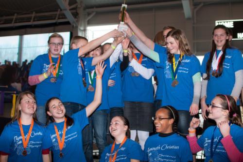 Students from Plymouth Christian School celebrate their 2013 Science Olympiad victory.