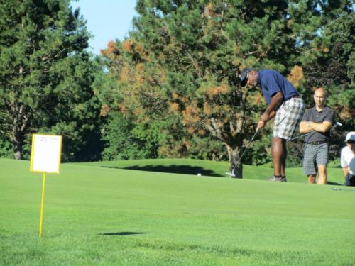 James Edwards attempts a putt at last year's Johnson Center Golf Outing.