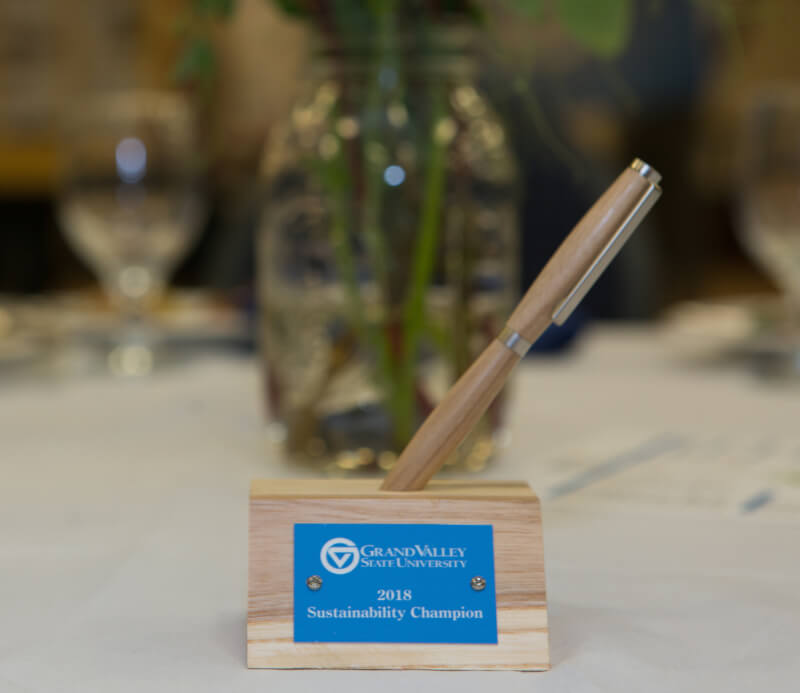 A photo of the award, a pen holder.