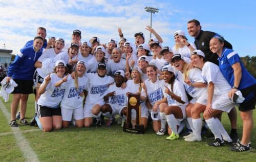 Photo courtesy of Sports Information/The Laker soccer team poses with the NCAA Division II national championship trophy.