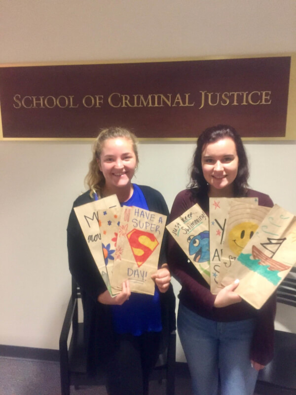 Criminal justice student workers Melissa Dondzila, left, and Andria Zwerk