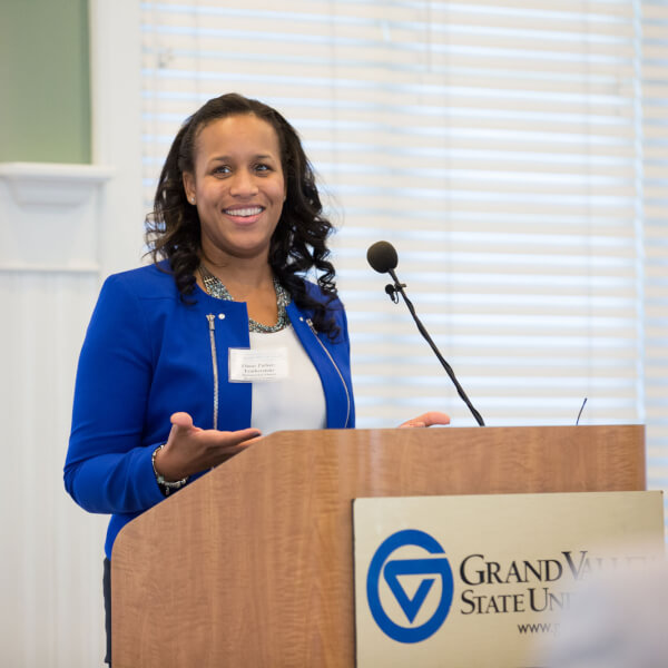 Ebony Parker Featherstone, '02, pictured speaking at the 2016 CLAS Alumni-in-Residence luncheon.