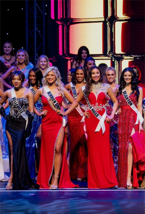 Miss Michigan USA candidates stand onstage during competition.