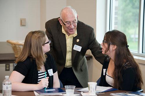 (Photo by Dianne Carroll Burdick) Sheldon Kopperl, professor of liberal studies, talks with students during the first Brooks College Professional Series event on September 7 in the Kirkhof Center.