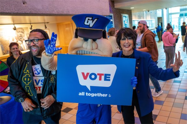 President Philomena V. Mantella, Robert Shorty and Louie the Laker pose for a picture as part of an event at the Kirkhof Center encouraging the GVSU community to vote on November 5. Shorty is vice president for People, Equity and Culture.