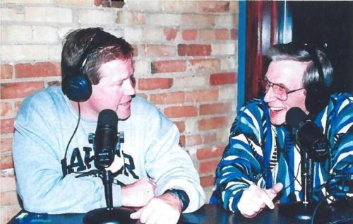 Dick Nelson, right, is pictured interviewing former coach Brian Kelly. Nelson died February 1.