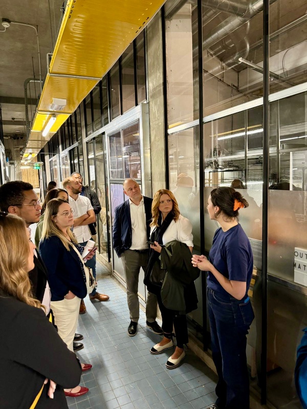 Members of the GVSU EMBA cohort listen to a guide during a tour of Blue City, a business incubator in Rotterdam, the Netherlands.