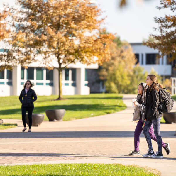 students walk on campus