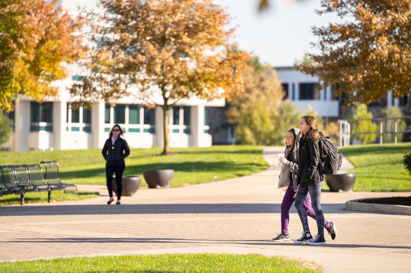 students walk on campus