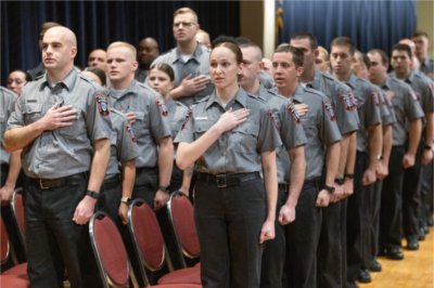 The GVSU Police Academy recruits say the pledge of allegiance to open the ceremony