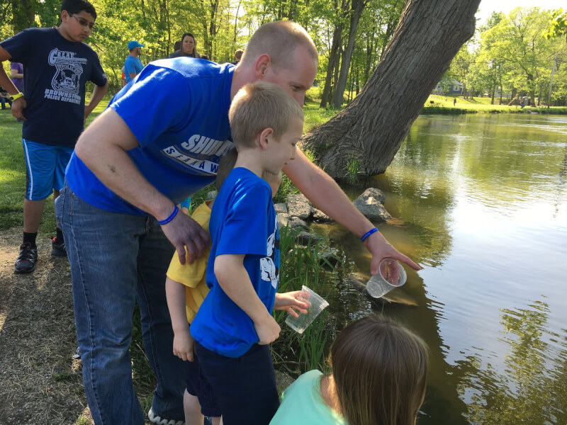 Jeff Bouwman, '03, incorporates fish research into his middle school science classes through a DNR program.